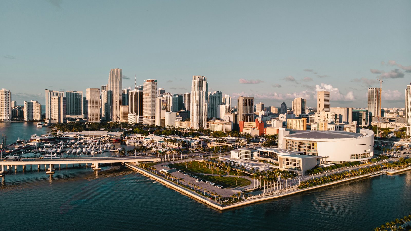 Downtown Miami and Brickell skyline at golden hour, viewed across Biscayne Bay